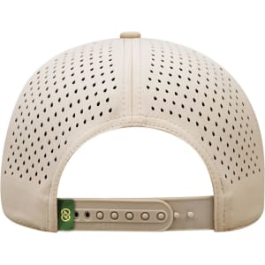 A beige perforated cap with a flexible strap at the back and a logo on the side.