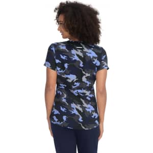 A casual top featuring a blue, black, and grey camouflage print, with short sleeves and a relaxed fit.