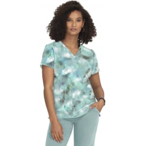 A women's V-neck top featuring a turquoise and grey tie-dye pattern, with short sleeves and a front pocket.