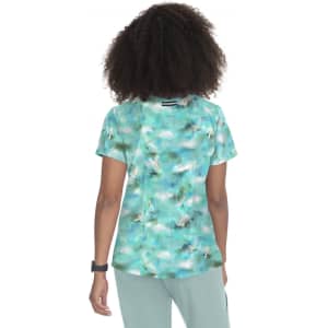 A short-sleeved top featuring a vibrant turquoise and white abstract print, with a logo on the back.
