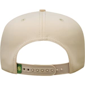 A beige cap with a rear adjustable strap and ventilation holes, featuring a branding logo.