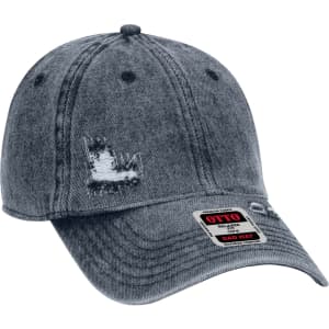 A distressed denim 6 panel dad hat with a curved brim and a logo on the front.