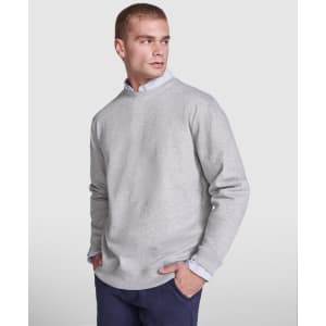 A grey Batian sweatshirt, featuring a relaxed fit and long sleeves, displayed on a model. It has a subtle logo.