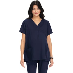 A maternity top in navy blue with a v-neckline, short sleeves, and a front pocket, featuring a branding logo.