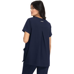 A navy maternity top featuring short sleeves and a pleated back design, with a branding logo on the back.