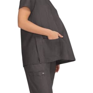 A grey maternity top featuring a pocket, designed for comfort with a loose fit for expectant mothers.
