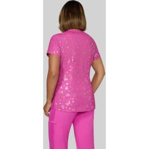 A pink printed top with a shiny finish, featuring a floral pattern, paired with matching pink trousers.