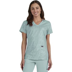 A mint green scrub top with a v-neck design, featuring a subtle print and a logo.
