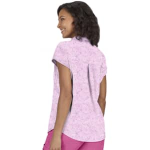 A women's short-sleeve top in pink with a floral print, featuring a back pleat and a rounded hem.