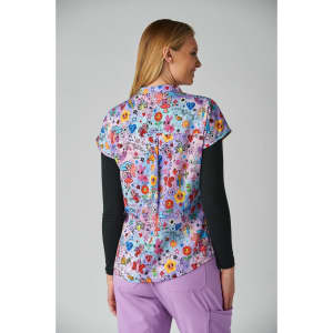 A floral-patterned, short-sleeved top in purple and various bright colours, featuring a logo at the back.