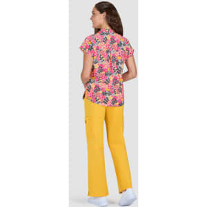 A floral short-sleeve top in pink and orange paired with yellow pants, displayed from the back. Features a logo.