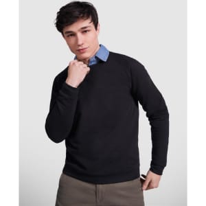 A black sweatshirt worn by a young man, featuring a layered look with a blue collared shirt underneath.