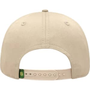 A beige six-panel pro style cap with an adjustable strap and a logo on the back.