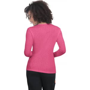 A long-sleeve tee in vibrant pink with a textured pattern and a crew neck design. It has a logo on the back.