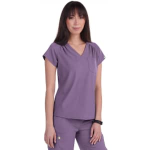 A violet scrub top featuring short sleeves and a pocket, designed with a flattering V-neck style.