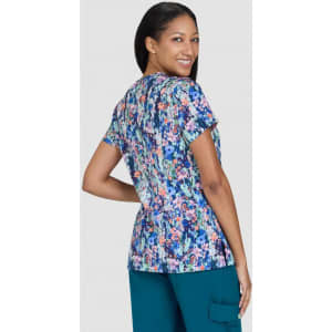 A floral print top with a variety of colours, featuring short sleeves and a relaxed fit. It has a logo.