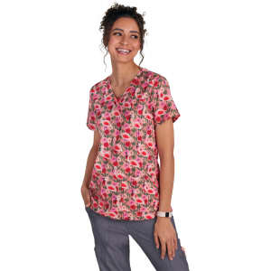 A floral print top in shades of pink and green, featuring a V-neckline and short sleeves, displayed on a model.