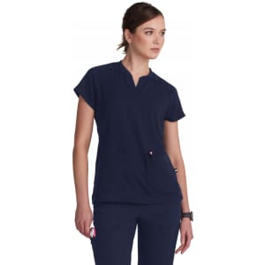 A navy blue tunic top with short sleeves and a V-neck, featuring pockets and a logo.