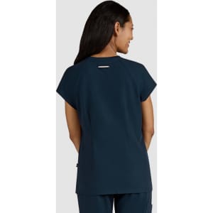 A navy top with short sleeves and a subtle logo detail on the back, designed for comfort and style.