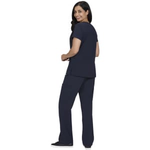 A woman wears a navy blue Sari Top paired with matching navy blue pants, facing slightly to the side.