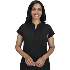 A black top with a short collar and a front pocket, featuring a pen. The model is smiling while standing.