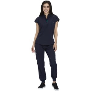 A navy blue medical uniform set featuring a short-sleeve top and cuffed trousers, paired with black shoes.