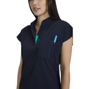 A navy blue top with a half-zip collar, featuring a pocket and a pen in the chest pocket. It has a logo.