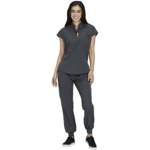 A grey women's scrubs set featuring a short-sleeve top with a pocket and matching pants. Includes a logo.