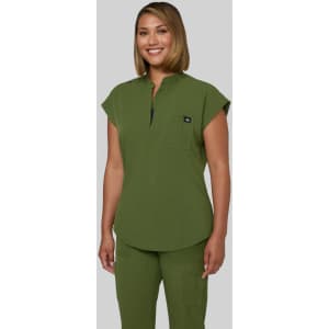 A top in olive green with a relaxed fit and a chest pocket, featuring a small branded logo.