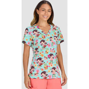 A vibrant mint green top featuring playful print illustrations of characters and flowers. The top has a V-neck design.