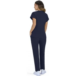 A woman wearing a navy blue top and matching pants, with a logo visible, facing away from the camera.