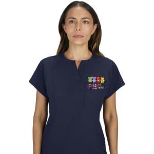 A navy placement top featuring a colourful embroidered design on the chest and a small pocket.