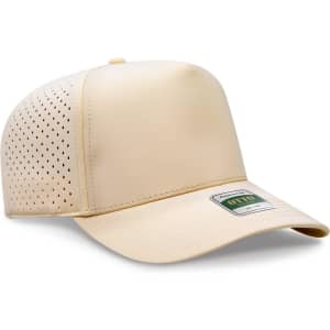 A light beige cap with a mid-profile design and perforated detailing, featuring a logo on the front.