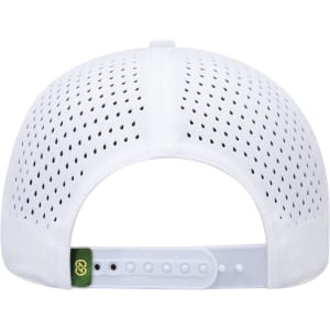 A white perforated cap with a green logo tag and an adjustable strap at the back.