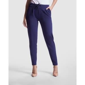 Navy stretch trousers with a slim fit and pockets, featuring a drawstring waist and paired with light-coloured heels.