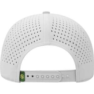 A white perforated cap featuring a back fastening and a logo on the side.