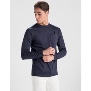 A navy long-sleeved T-shirt featuring a chest pocket, modelled by a young man. The shirt has a simple design and branding.