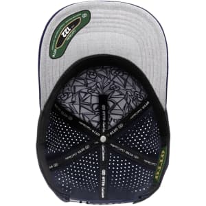 A grey and navy perforated cap featuring an inner patterned lining and a logo.
