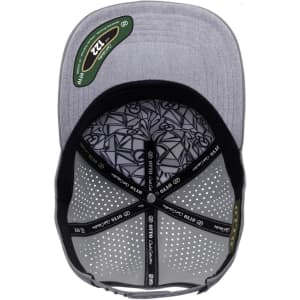 A grey perforated cap featuring a patterned interior and a logo, designed in a 5-panel pro style.