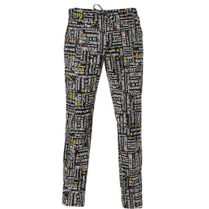 Patterned black and white trousers featuring various text and symbols, with hints of yellow. Includes a waistband with a logo.