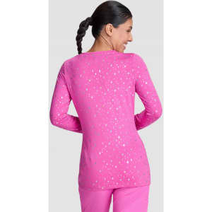 A pink long-sleeved top with a speckled pattern, featuring a round neckline and a fitted silhouette.