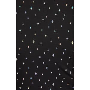 A patterned fabric featuring a black background with multicoloured diamond-shaped and triangular sparkles.