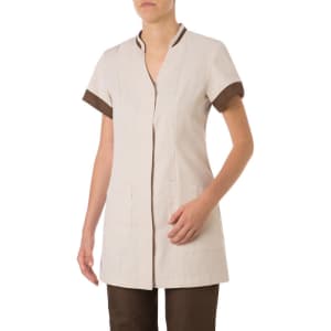 A tunic featuring a beige body and brown sleeve cuffs, with a front opening and pockets. Branding visible.