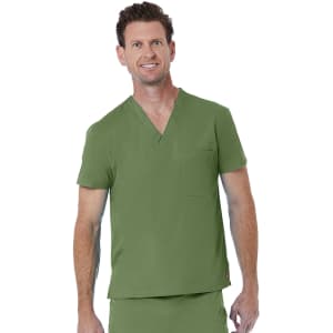 A unisex v-neck top in olive green with short sleeves and a chest pocket. The model is smiling.