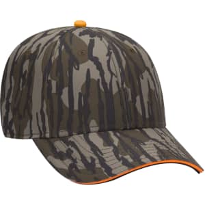 A camouflaged cap in shades of green and brown, featuring an orange accent and a logo on the front.