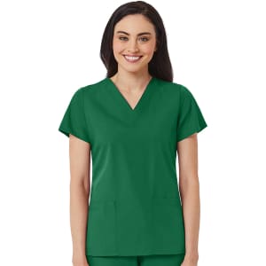 A woman wearing a green V-neck top with short sleeves and two pockets. The design is simple and practical.