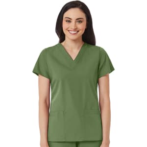 A green women's V-neck top featuring short sleeves and two front pockets. The model smiles while wearing the top.