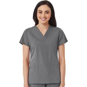 A women's v-neck top in grey, featuring short sleeves and two front pockets, modelled by a smiling woman.