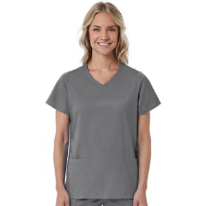 A women's mock wrap top in grey, featuring short sleeves and two front pockets. The top has a logo on it.