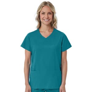 A women's mock wrap top in teal, featuring short sleeves and two front pockets. The top has a branding logo.